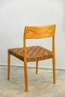 Cadeira de jantar com estrutura em madeira nobre e assento trançado em couro legítimo. Design sofisticado e ergonômico, ideal para salas de jantar refinadas. Acompanha uma unidade.